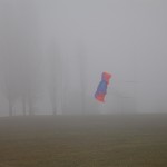 Kite flying at Vanier Park on a foggy February day.