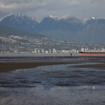 North Vancouver seen beyond the tidal flats of Spanish Banks West.